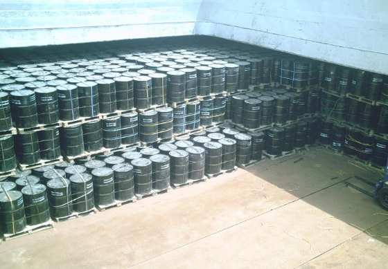 Drums stuffed into a container, floor to door